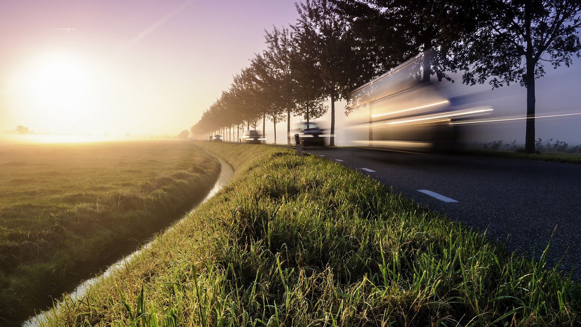 Rural road in Zeeland at sunrise